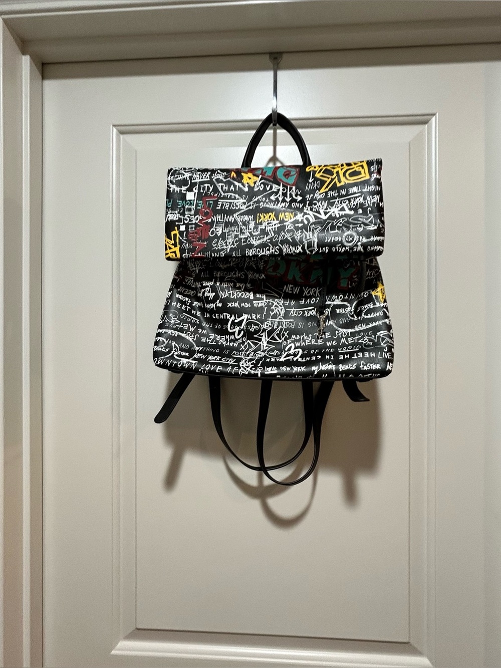 DKNY Tilly NWT Black Graffiti fold over Women's Backpack with Colorful Accents
